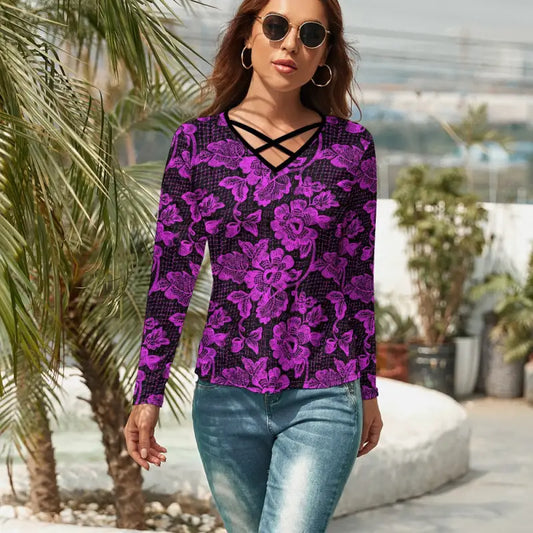Purple floral long sleeve V neck top with criss cross neckline detail styled with jeans