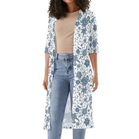 Size inclusive floral kimono cardigan layered over neutral top and denim
