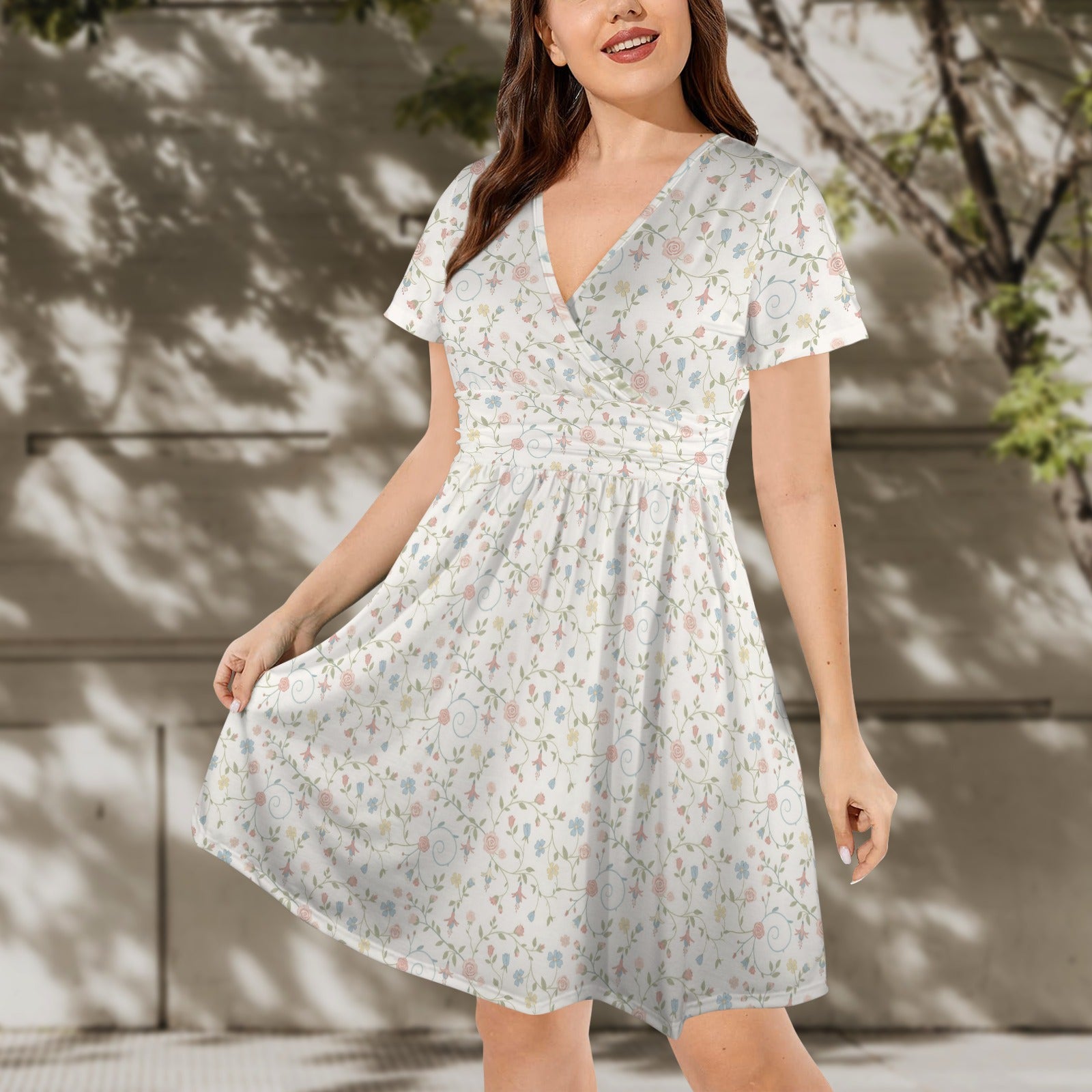 Soft botanical print dress with flared skirt movement