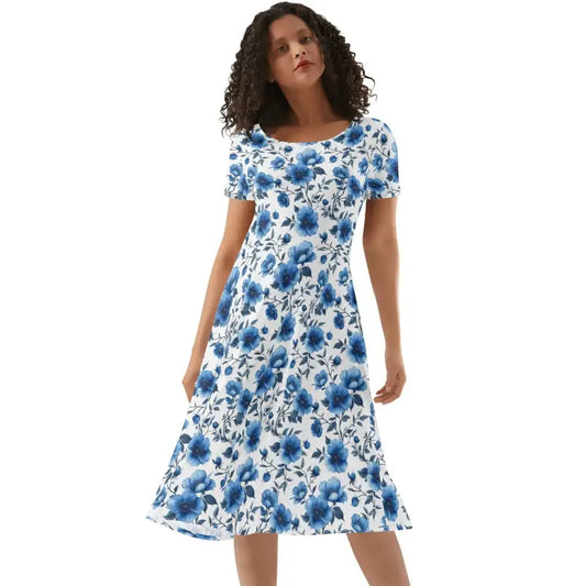 Woman wearing blue floral short sleeve fit and flare dress with scoop neckline and knee-length hem