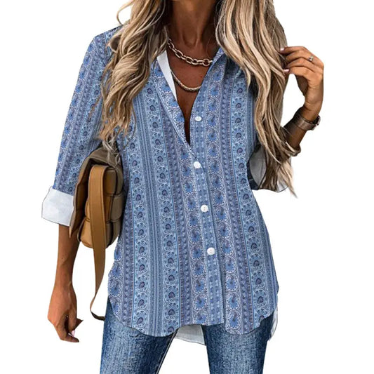 Woman wearing blue mosaic print tailored button-down blouse with rolled sleeves