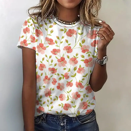 Woman wearing coral floral cotton t shirt with classic crew neckline and relaxed fit