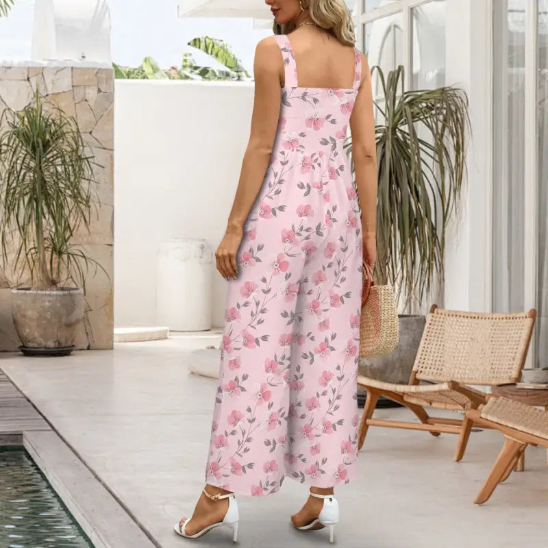 Pink floral jumper with shoulder straps and flowing silhouette, perfect for any occasion