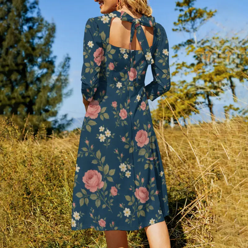 Woman in boho basic style dress with floral print and tie-back cutout