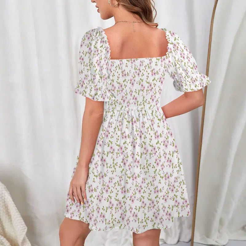 White floral boho dress with puff sleeves and ruffle hem for fun flouncy style