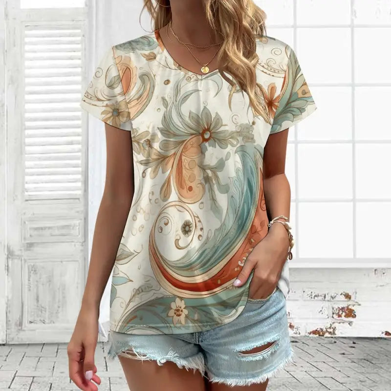 Floral print boho V-neck short sleeve t-shirt in mint green, peach, and cream colors