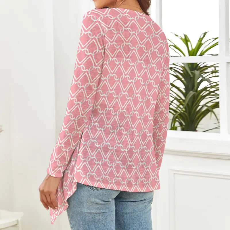 Pink and white geometric patterned long-sleeve top with an asymmetrical hem for women’s Valentine’s Day