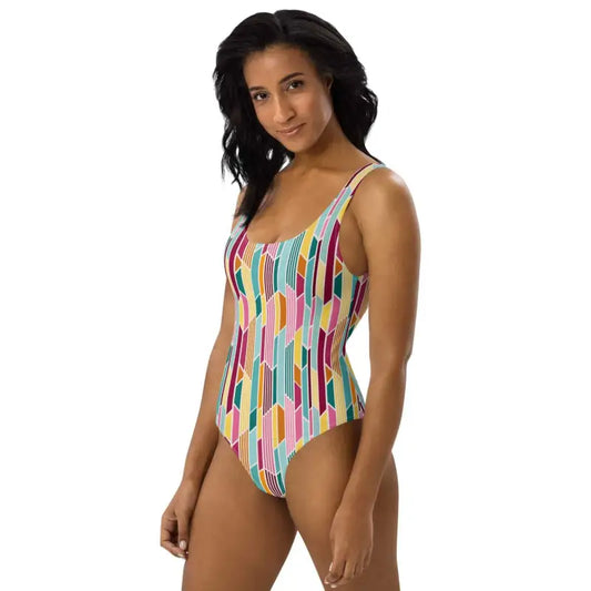 Woman with long dark hair rocking a Multi Color Geometric Print One-Piece Swimsuit