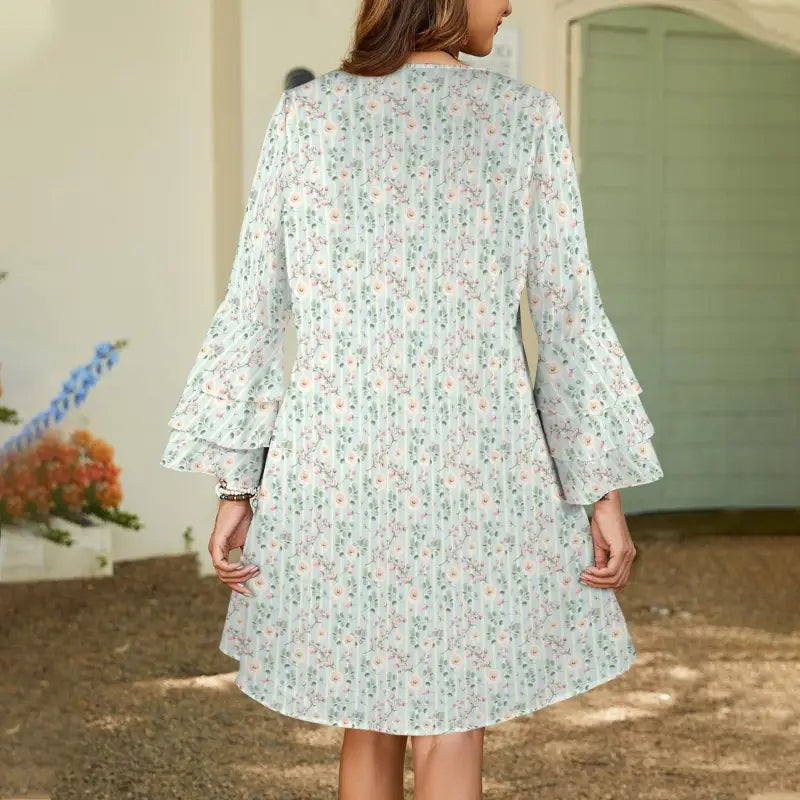 White floral print dress with flared sleeves perfect for boho vibes and summer outings