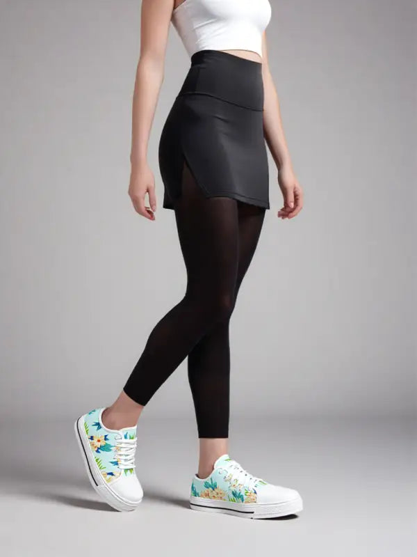 Black high-waisted skirt with floral canvas sneakers