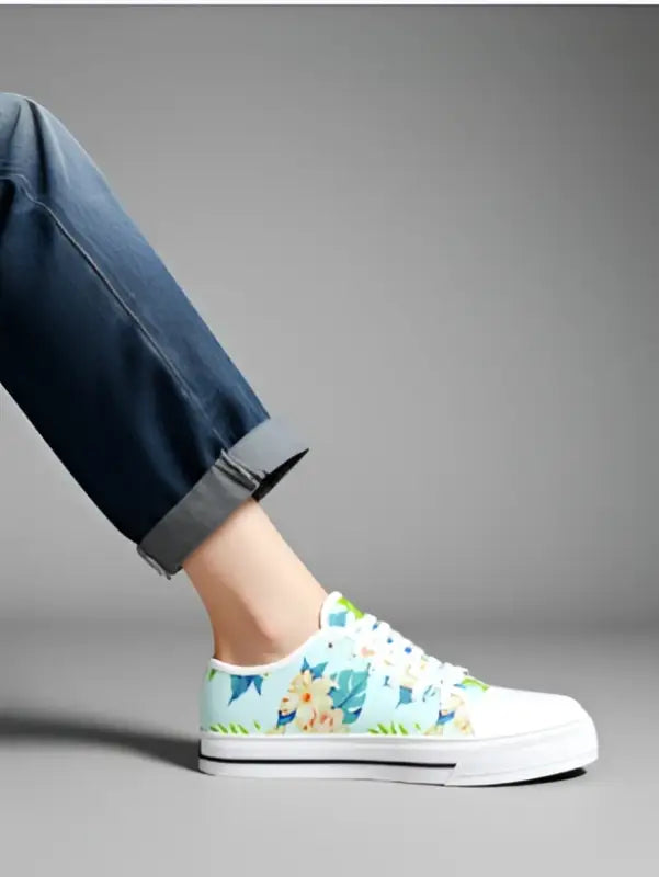 Light blue floral canvas sneakers with colorful pattern and white laces