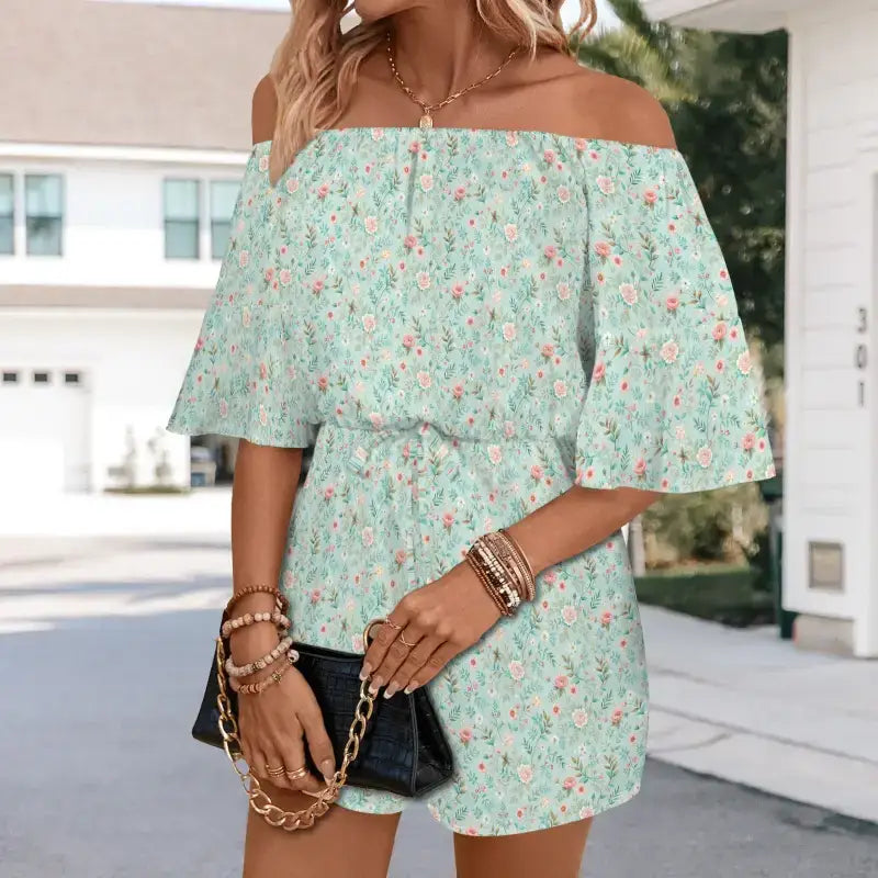 Mint green floral off-shoulder romper with flutter sleeves and secret pockets for summer fun