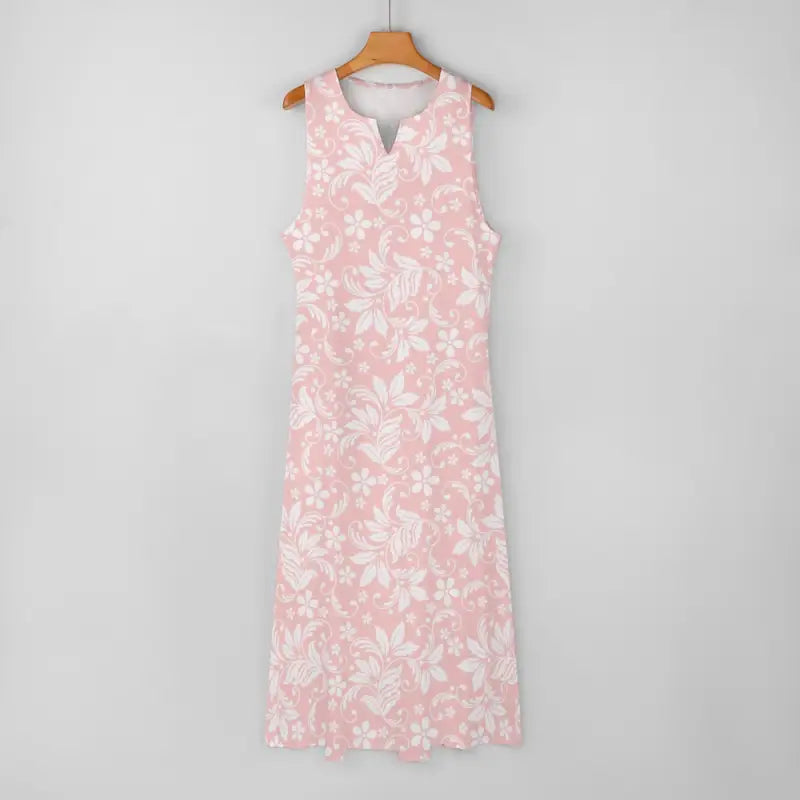 Floral maxi dress in pink and white hanging on a wooden hanger, perfect for women’s style