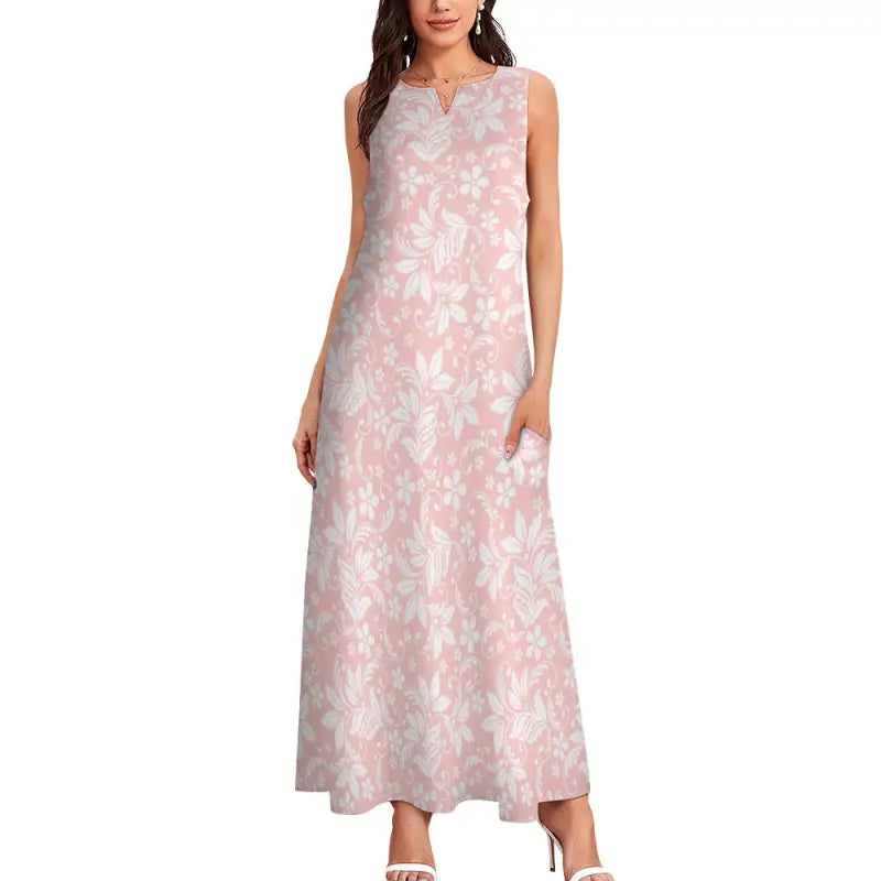 Sleeveless pink floral maxi dress with V-neck, perfect for sunny days out!