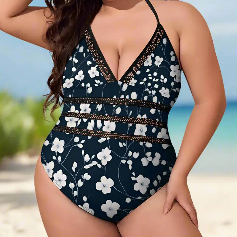 Floral one-piece swimsuit in navy blue with white print and chic halter neck for plus-size babes