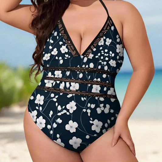 Floral one-piece swimsuit in navy blue with white print and chic halter neck for plus-size babes