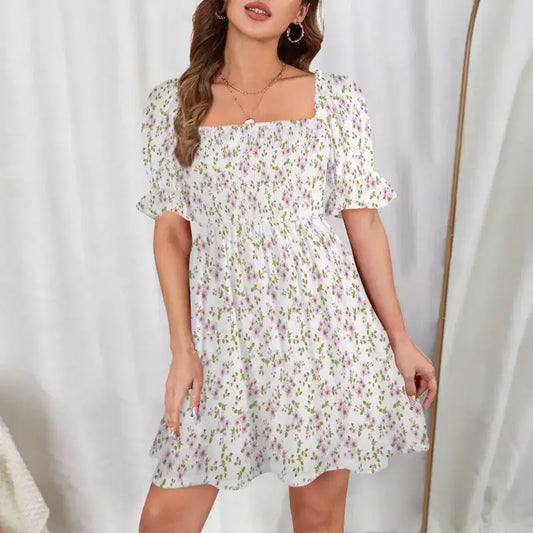 White floral print mini dress with puff sleeves and ruffle hem in flouncy style