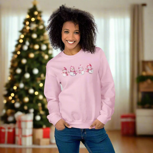 Pink snowman Christmas sweatshirt featuring cute cartoon snowmen for a cozy vibe