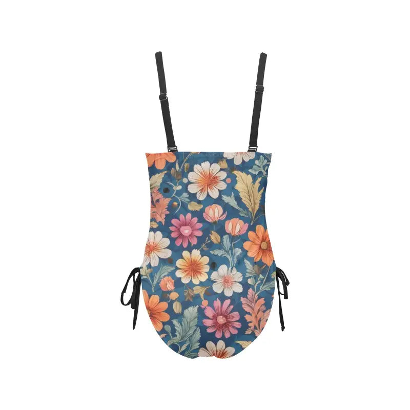 Floral ruched one-piece swimsuit with adjustable straps and side ties, perfect for summer fun