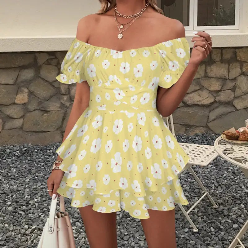 Stylish yellow floral off-shoulder romper with ruffled layers for a boho vibe