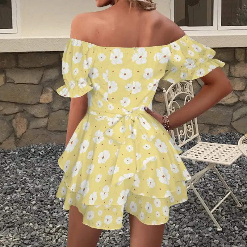 Chill in this yellow floral off-shoulder romper with puff sleeves and a ruffled skirt