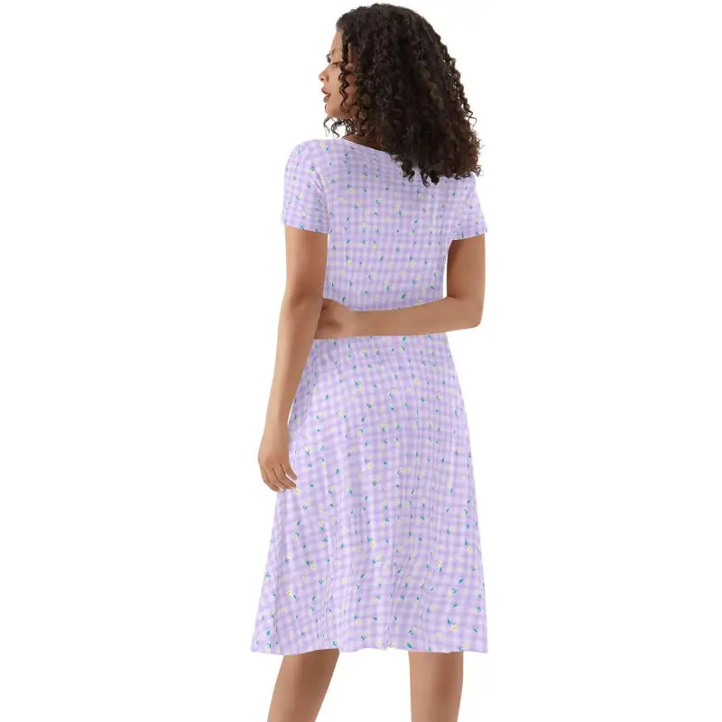 Womens purple plaid short sleeve dress on a woman with curly hair, perfect for any occasion