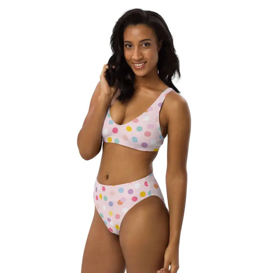 Woman rocking a pink polka dot sport bikini with a stylish crop top and high-waisted bottom