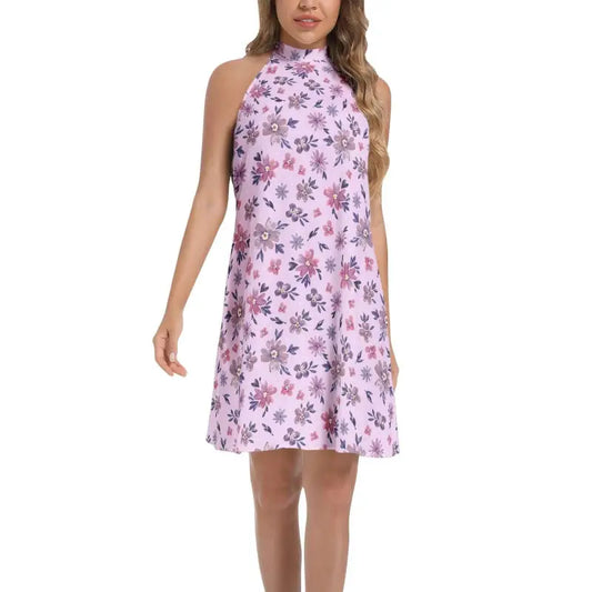 Sleeveless halter neck flared dress in purple floral print, perfect for summer fun