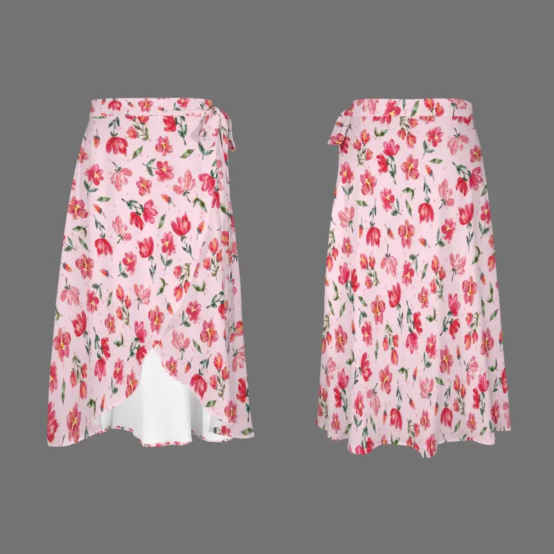 Pink floral wrap skirt featuring vibrant pink and red flowers on a white background