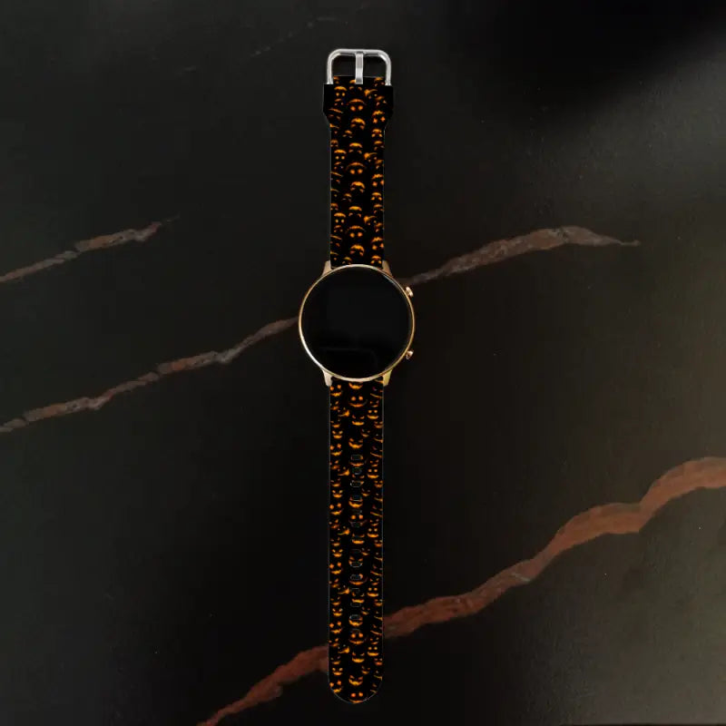 Elegant 22mm Universal Wristwatch with dark patterned band and gold face for Halloween fun