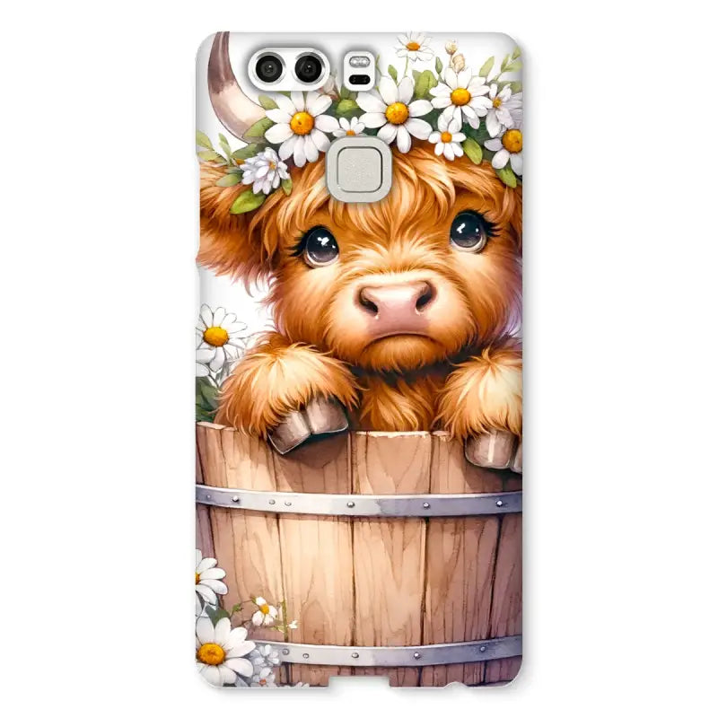 Adorable Highland Cow calf with flower crown on a wooden barrel for Highland Cow Snap