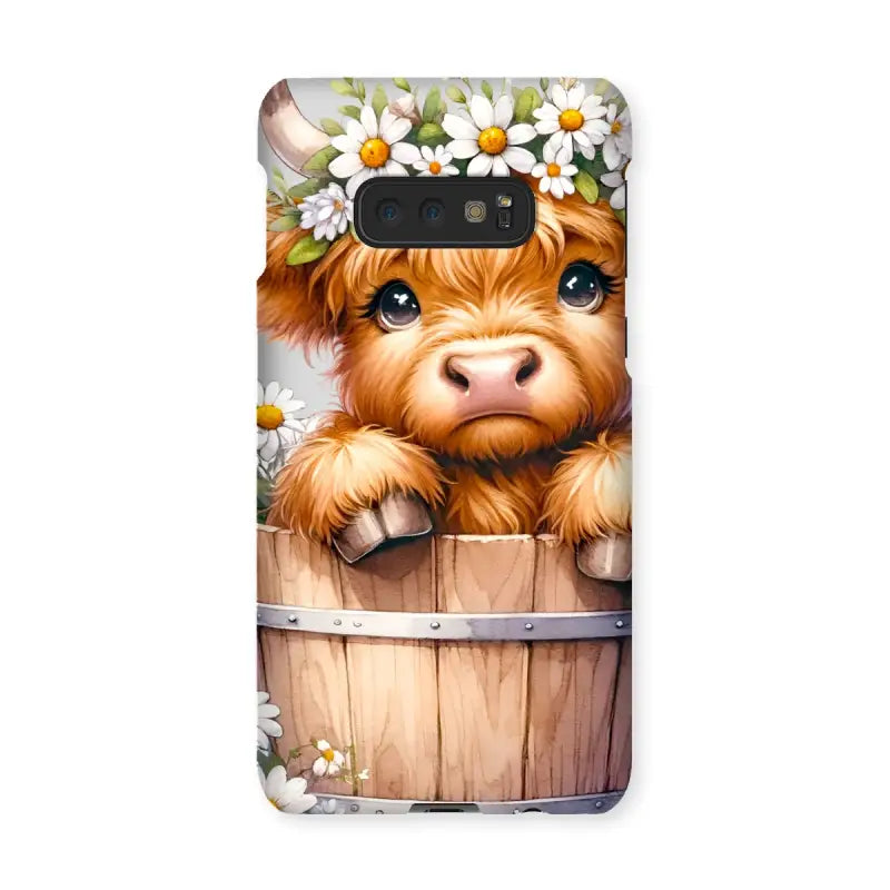 Cartoon Highland Cow calf with daisy crown peeking from barrel on Highland Cow Snap