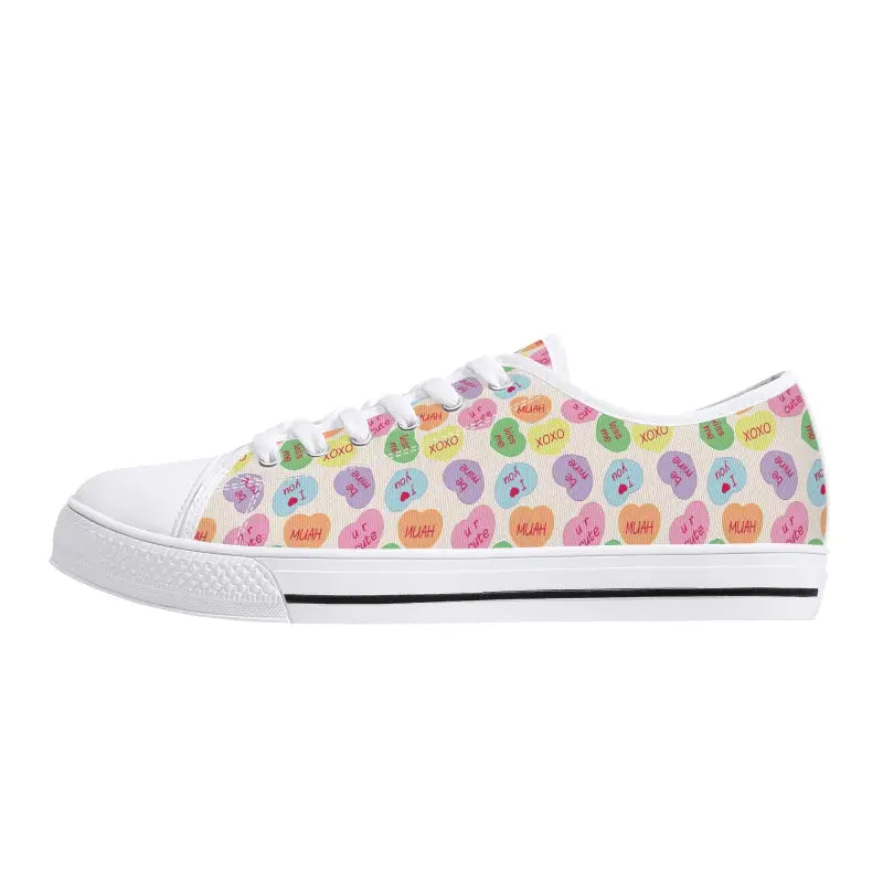 White womens low canvas sneakers with colorful candy hearts pattern for fun style