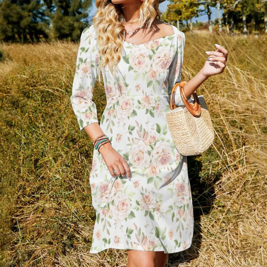 Floral print dress with long sleeves and knee-length hemline, featuring rose print sweetheart