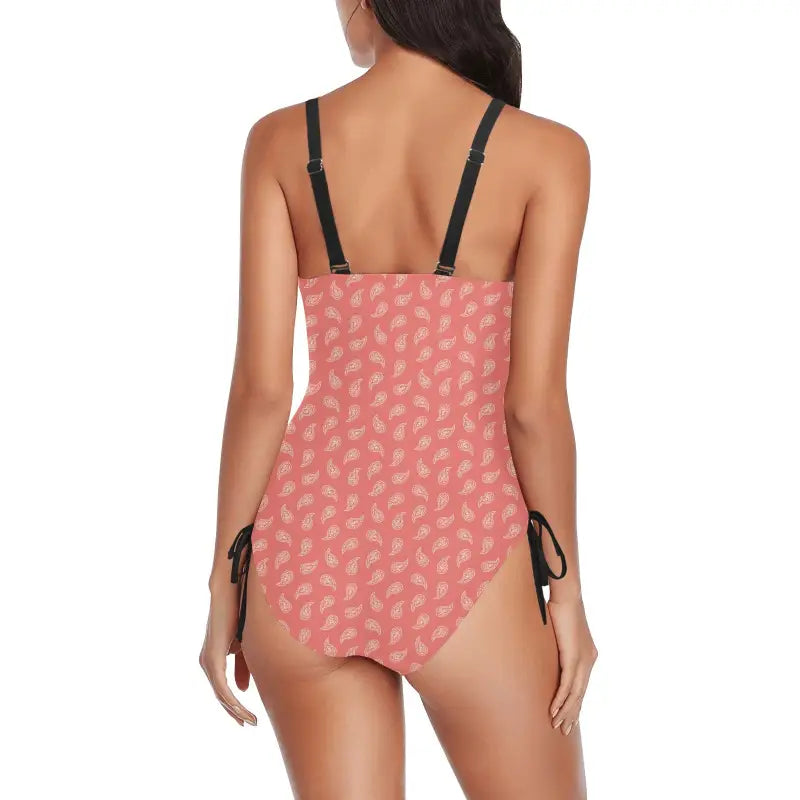 Pink ruched paisley one-piece swimsuit with black straps and side ties for boho vibes