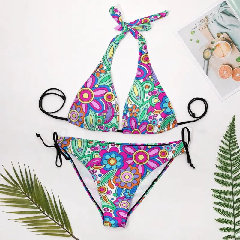 retro floral halter bikini flat lay colorful floral swimwear set