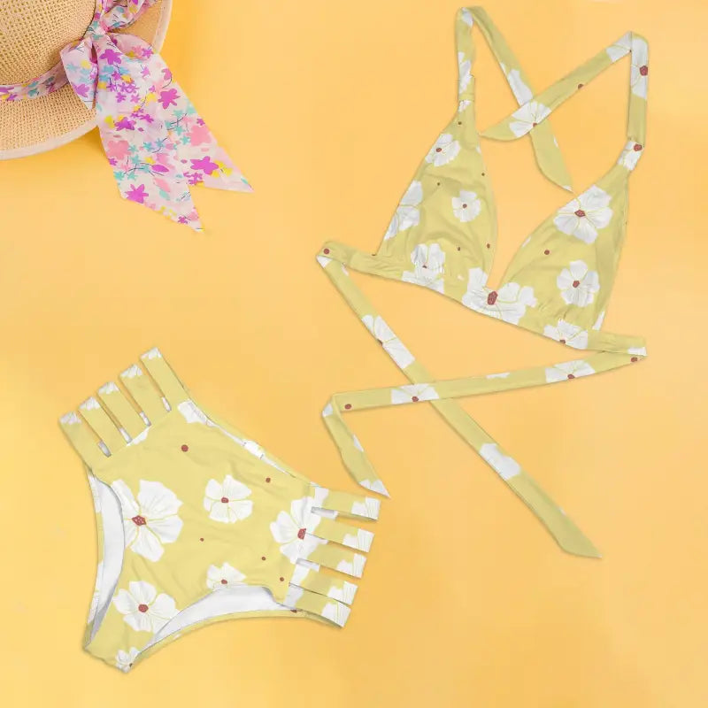 Pastel yellow floral bikini set with strappy details and white flowers for a fresh vibe