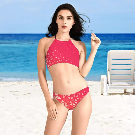 Woman rocking a pink geometric pattern bikini with cool cutouts at the beach