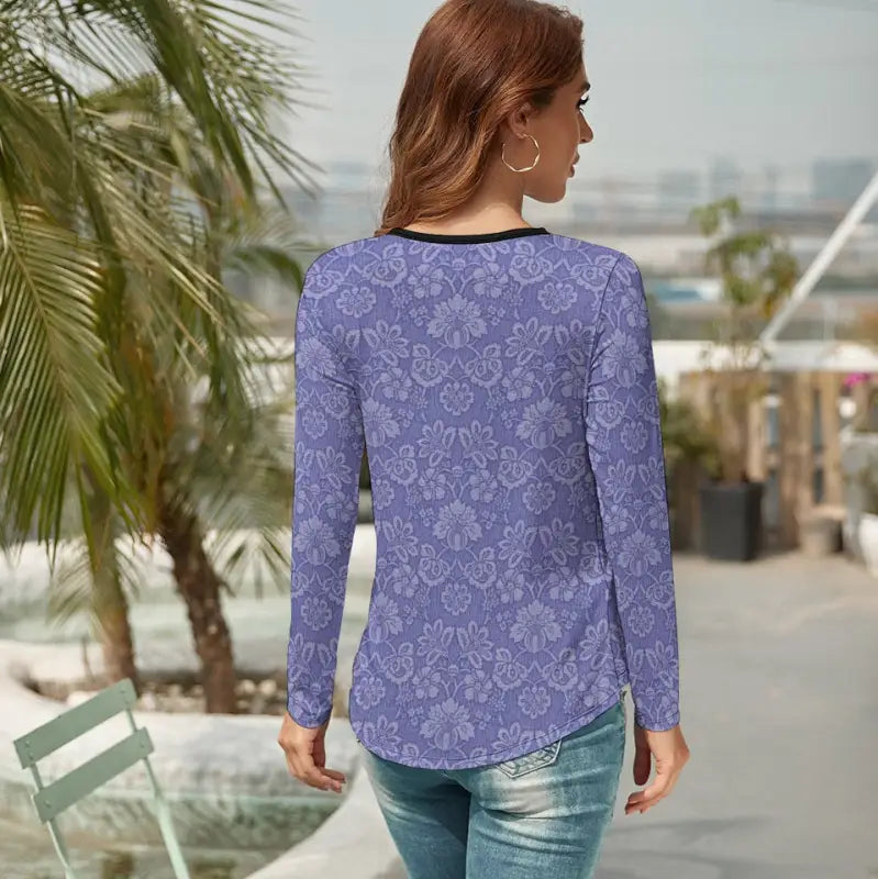 Purple floral long sleeve t-shirt with a curved hemline for a casual vibe