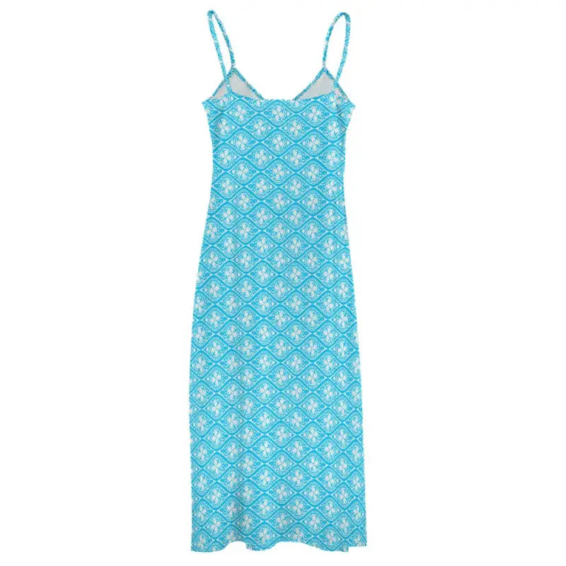 Turquoise sleeveless boho maxi dress with white floral pattern and thin straps