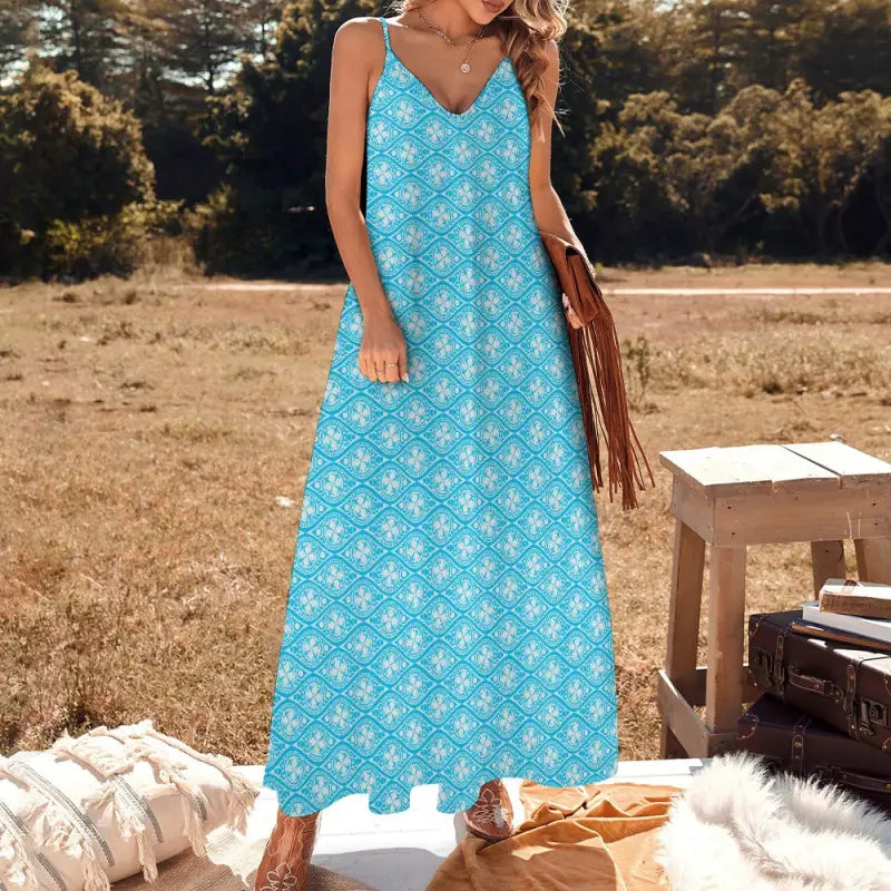 Bright blue sleeveless boho maxi dress with white floral pattern for effortless style