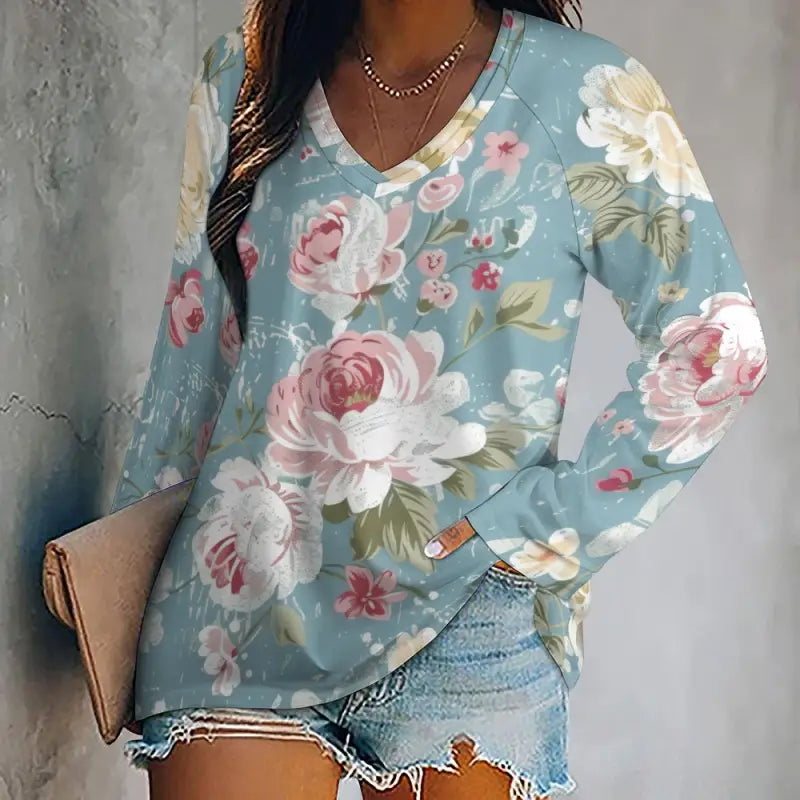 Light blue floral long-sleeved t-shirt with v-neck design