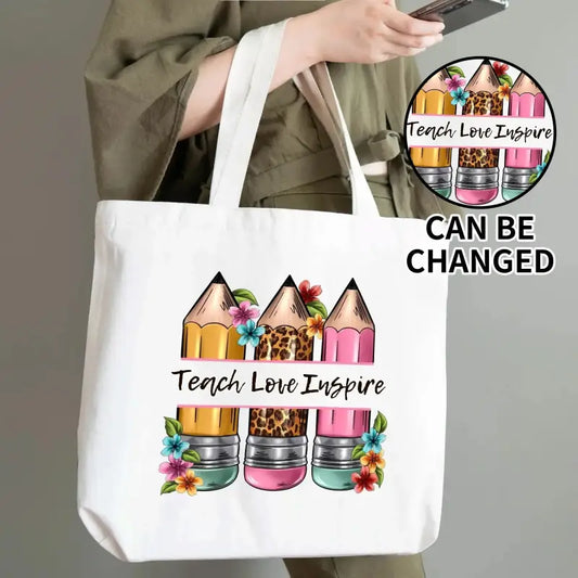 White Teacher Cotton Tote Bag with colorful pencil design and Teach Love Inspire phrase