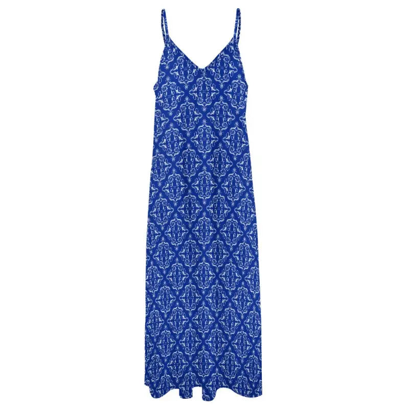 Blue boho maxi dress with spaghetti straps and a chic white pattern perfect for twirling