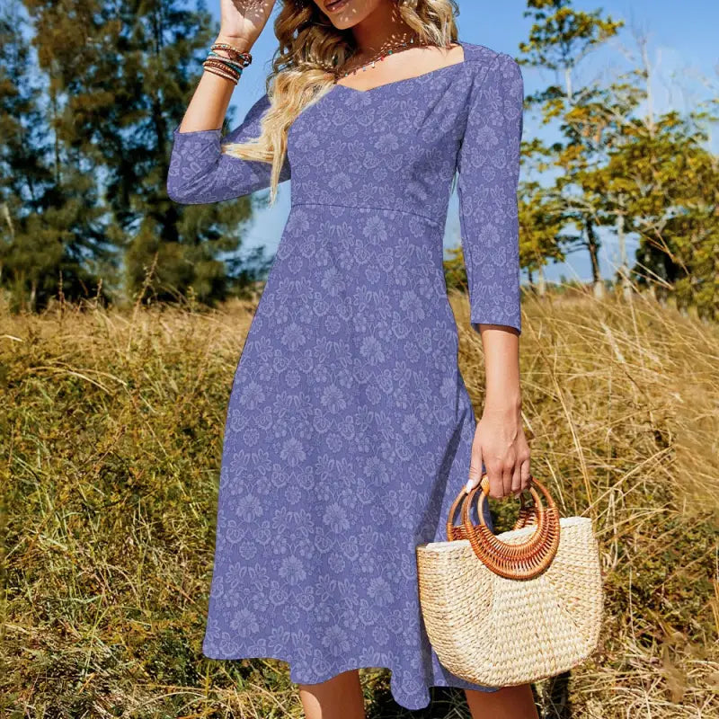 Periwinkle blue textured midi dress with sweetheart neckline and 3/4 sleeves, perfect for twirling