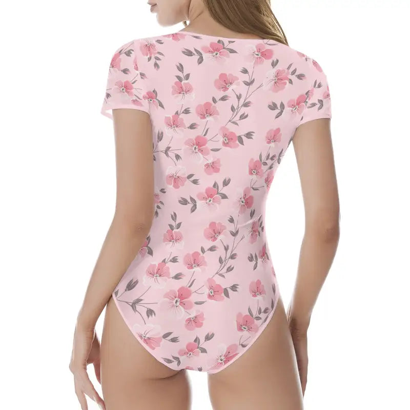 Pink floral bodysuit with short sleeves featuring a delicate rose pattern for women