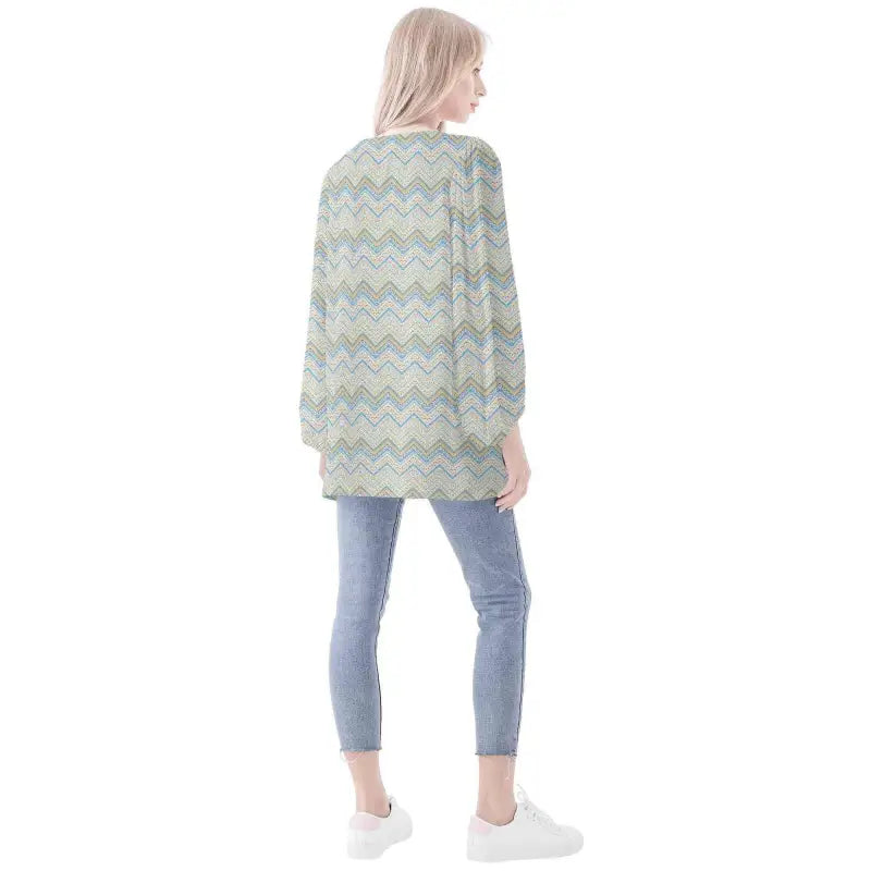 Chevron-patterned mint green boho long sleeve sweater over blue jeans for a chill vibe