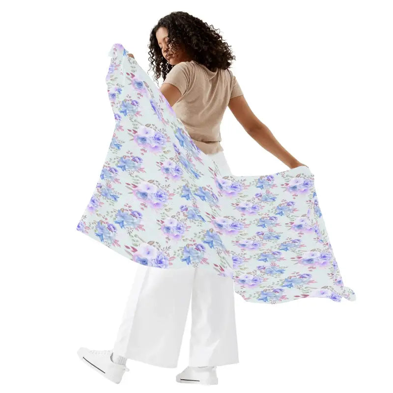 Woman holding a Womens Blue Pattern Sarong Cover featuring a vibrant floral design