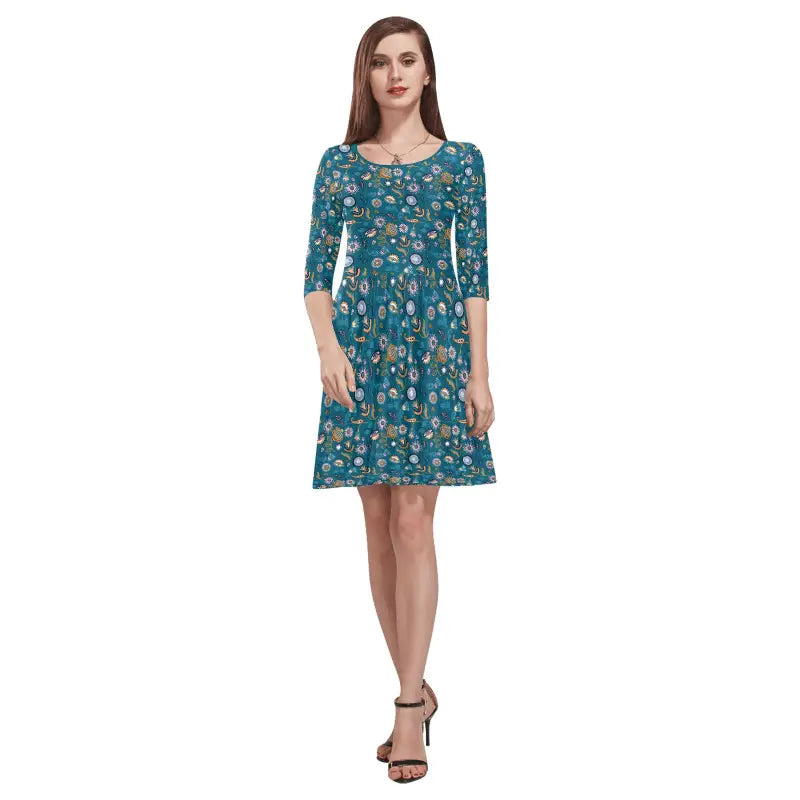 Teal floral print dress with three-quarter sleeves, perfect for a women’s boho floral look